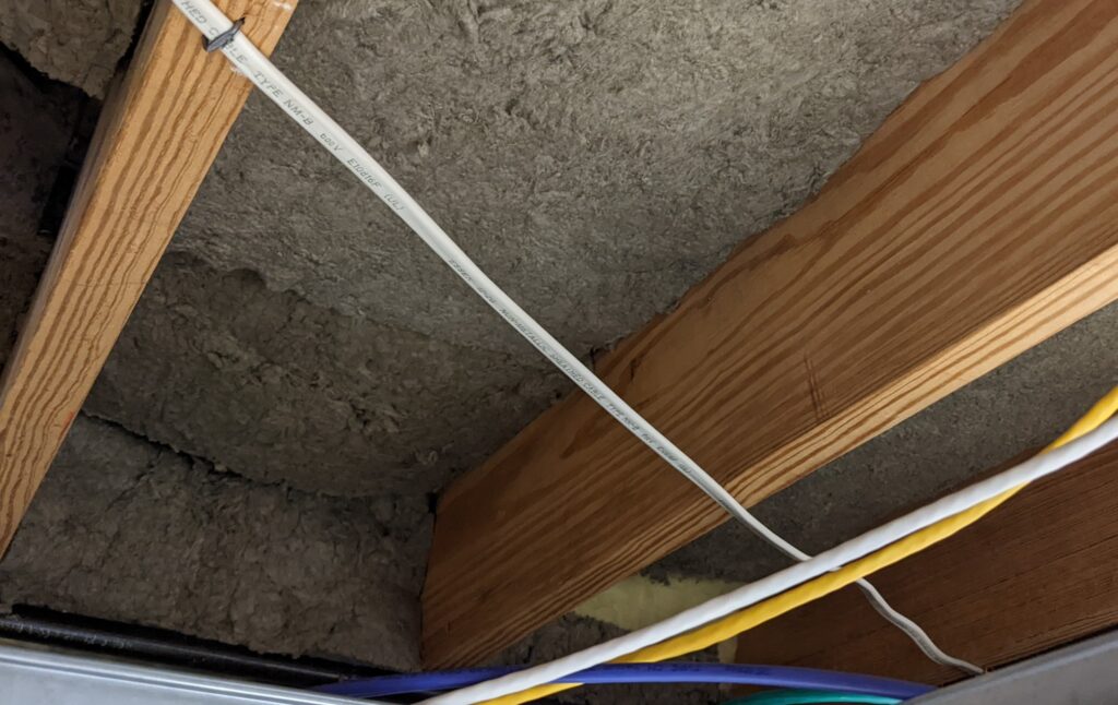 Rockwool tucked into the rim-joist cavities along the basement perimeter. This unexpectedly reduced how much outside noise reached my workspace.