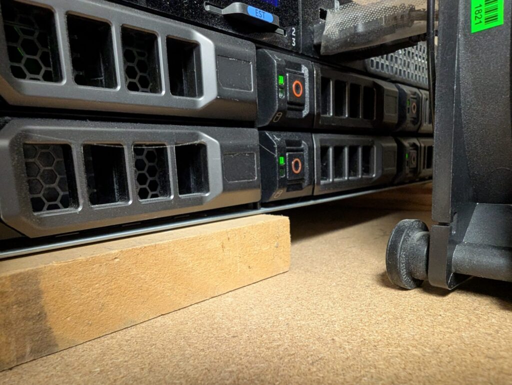 Two MDF ledger boards lift the server about 3/4" off the shelf. An addition I should have made in the first place.