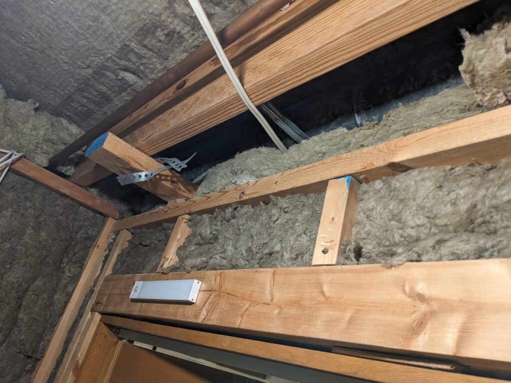 Sump room- stuffing Rockwool everywhere